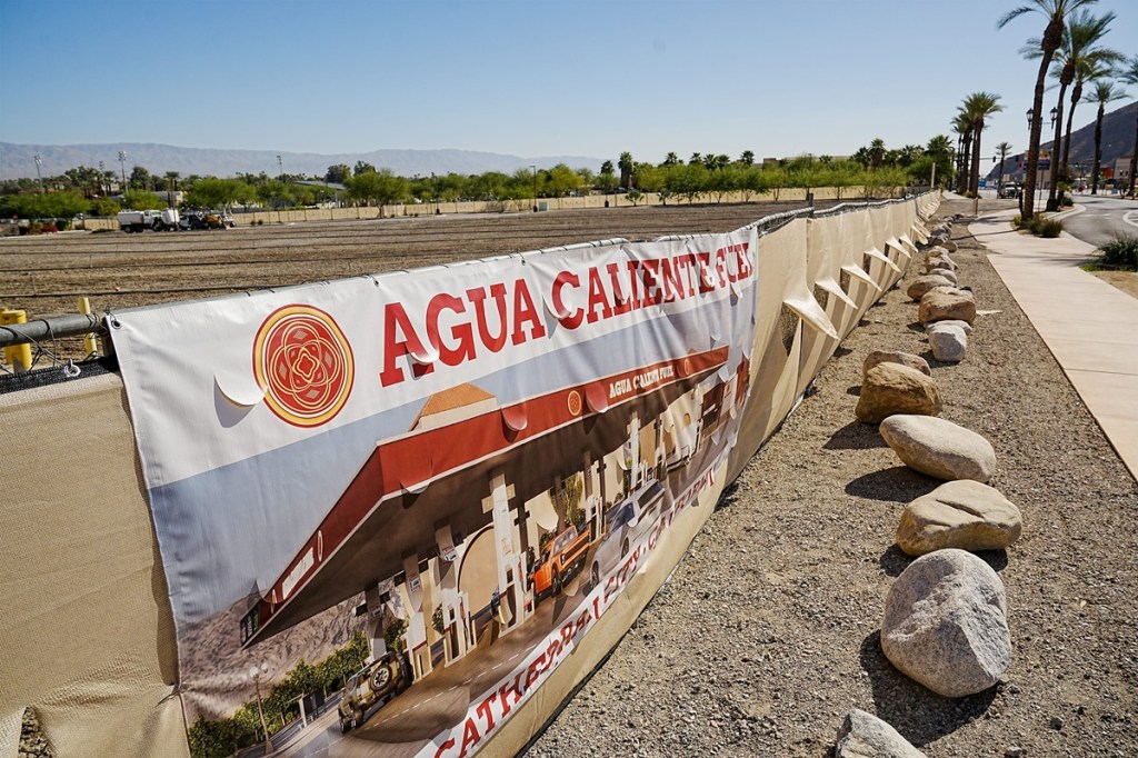 A sign for a new Agua Caliente Fuel station