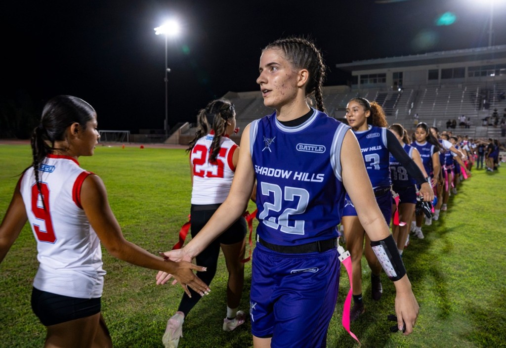 Vanessa Monaco shakes hands with an opposing team after a game