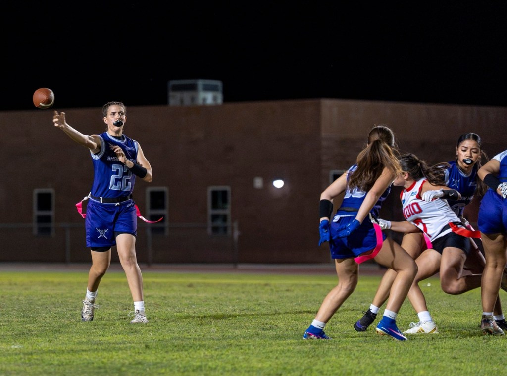 Vanessa Monaco throws a pass